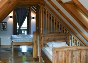 a bedroom with two beds in a attic at Kuća za odmor Josipa in Klanjec