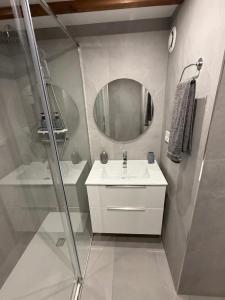 a bathroom with a sink and a mirror at Maison de la mer in Hendaye +9 photos
