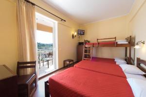 Postel nebo postele na pokoji v ubytování Sunset Hotel