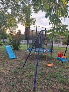 a playground with two swings and a slide at Vila Dara 1924 in Tivat +15 photos