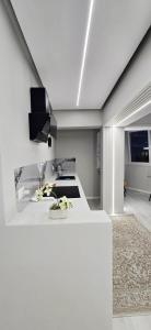 a kitchen with a white counter in a room at Promenade Apartment ,Sea view in Durrës