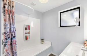 a bathroom with a sink and a mirror at Welcome to Wigan in Gore