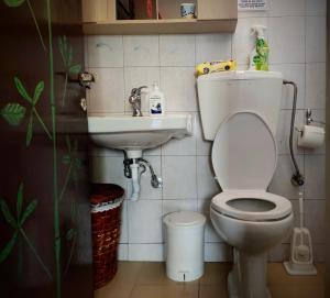a small bathroom with a toilet and a sink at Jenny's House in Yerakiní +26 photos