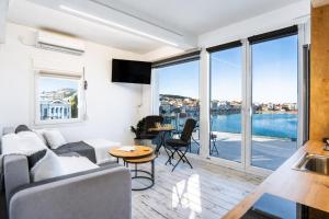a living room with a couch and a table at Utopia View in Mytilene