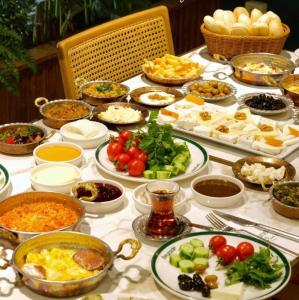 a table topped with lots of different dishes of food at The Haze Karaköy in Istanbul