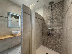 a bathroom with a shower and a sink at Larrouy in Asson +42 photos
