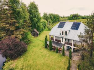 an aerial view of a house with solar panels on the roof at Ezernieki in Valka