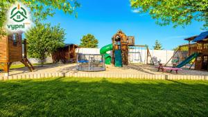 a park with a playground with a slide at Chalupa Oslany in Oslany