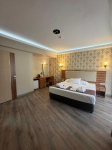 a large bedroom with a bed and a desk at Almero Termal Spa Otel in Termal +14 photos