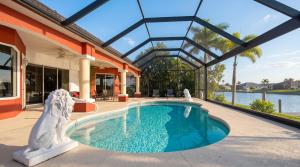 a swimming pool in a house with a building at Villa Princess in Cape Coral