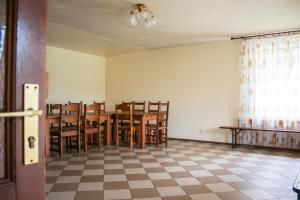 a dining room with a table and chairs at Ezernieki in Valka