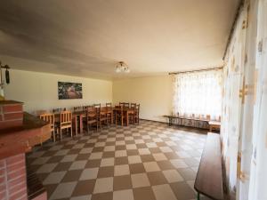 an empty room with a table and chairs at Ezernieki in Valka