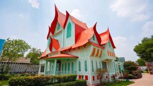 a building with a colorful roof on a street at MSG Hotels And Resort in Sirsa
