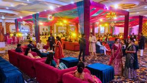 a group of people sitting on couches in a room at MSG Hotels And Resort in Sirsa +171 photos