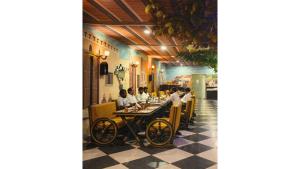 a group of people sitting at a table in a restaurant at MSG Hotels And Resort in Sirsa