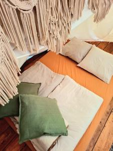a room with several pillows on the floor at Cihelna 10 Teepee&Wine in Hlavňovice