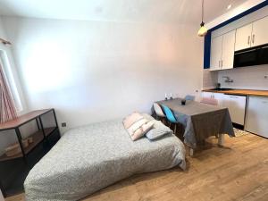 a bedroom with a bed and a table in it at CasaGerman in Sierra Nevada +7 photos