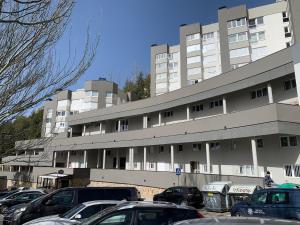 a large building with cars parked in front of it at CasaGerman in Sierra Nevada