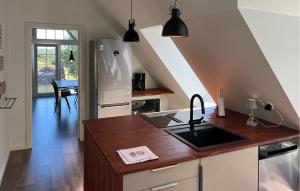 a kitchen with a sink and a counter top at Penthouse in Hobro