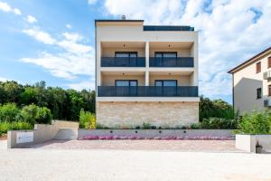 a building with balconies on the side of it at Asterias Residence - New Opening 2026 in Rovinj
