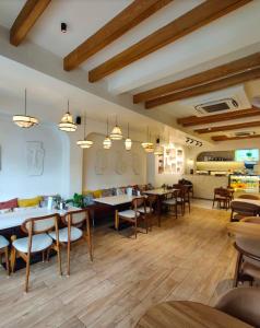 a restaurant with tables and chairs in a room at Vista10 in Bhopal +17 photos