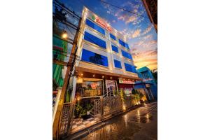 a building on the side of a street at sunset at Hotel Sairaj inn - Restaurant - Free Wi-Fi - Premium Rooms - Balcony - Parking in Puri