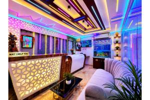 a living room with a couch and a tv at Hotel Sairaj inn - Restaurant - Free Wi-Fi - Premium Rooms - Balcony - Parking in Puri