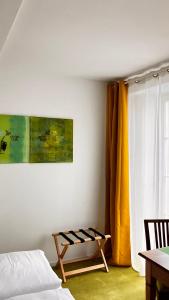 a bedroom with a bed and a yellow curtain at Wanderer und Radlerzimmer in Lieser