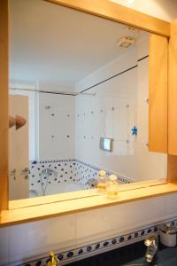 a bathroom with a bath tub with a shower at Ammos Lux Apartments in Agia Triada +278 photos