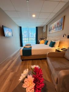 a hotel room with a bed and a couch at Rota Kadıköy in Istanbul