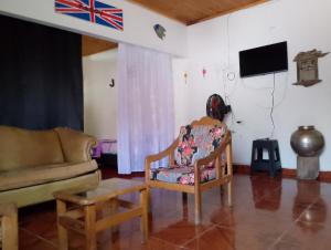 a living room with a couch and a chair at Brisas de la Bujona in Honda