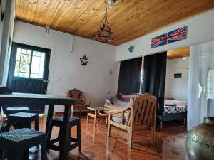 a living room with a table and chairs and a bed at Callejón del Sol in Honda