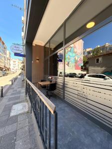a restaurant with a table in the window of a building at Rota Kadıköy in Istanbul