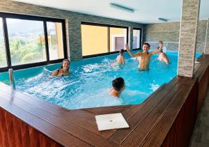 a group of people in a swimming pool at Lola's House in Jajce +37 photos