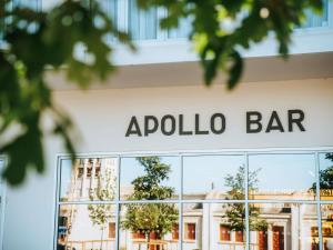a sign for the apollo bar on the facade of a building at ibis Styles Lens Centre Gare in Lens +106 photos