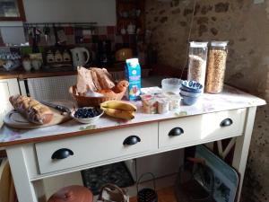 a table with some food on top of it at Le Tilleuil in Combiers +4 photos