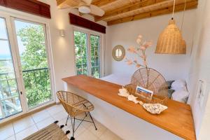 a kitchen with a counter and some windows at Billion Stars Studio in Thymonia Beach +14 photos