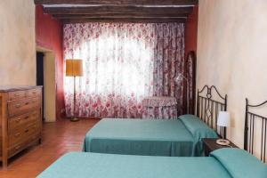 Cama o camas de una habitación en Apartaments Can Gibert