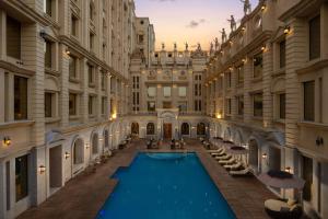 an indoor pool in the middle of a building at Blueworld Castles in Kānpur