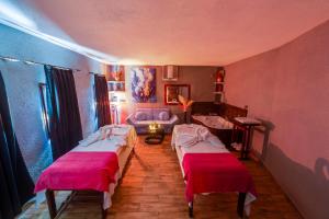 a living room with two beds and a couch at Bodrum Fora Holiday Resort in Bodrum City +39 photos