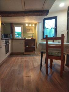 a kitchen with a table and a dining room at Ferienhaus an der Felsenkirche in Idar-Oberstein +5 photos