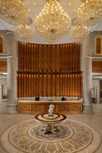 a lobby with a fountain in the middle of a building at Blueworld Castles in Kānpur +33 photos