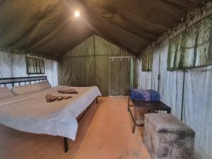 a bedroom with a large bed in a tent at starry nights stay in Batakūt