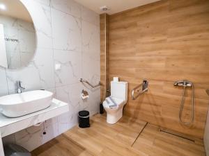 a bathroom with a sink and a toilet and a shower at Novus apartments in Skala Marion +31 photos