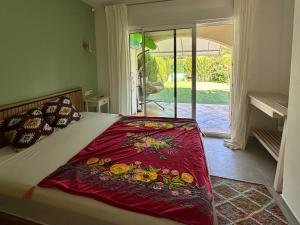 a bedroom with a bed with a red blanket at Onda in Denia +23 photos