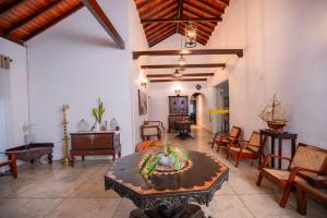 a large living room with a table and chairs at KapuGedara297 in Galle