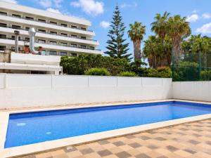 a swimming pool in front of a building at Mediterranean Escape - Sea Views Pool in Malgrat de Mar