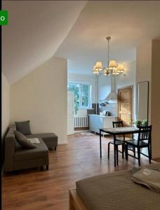 a living room with a table and a couch at K14 Stay 3 in Riga