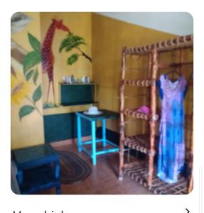 a toy room with a giraffe and a table at Furaha Rena -Kendwa in Kendwa
