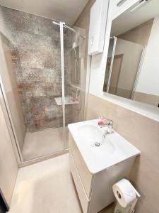 a bathroom with a sink and a shower at Utkiek in Fehmarn +28 photos